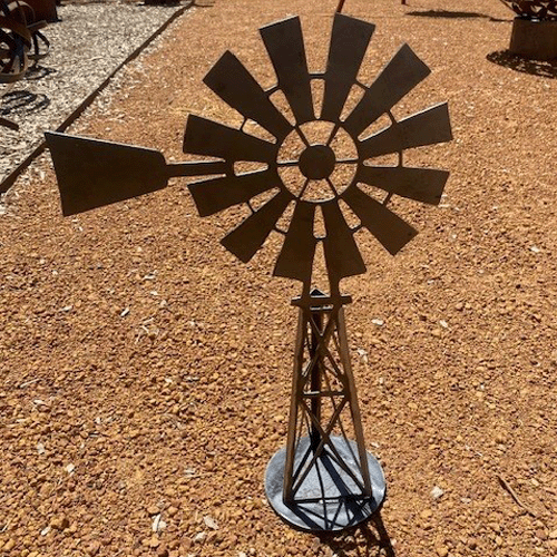 Southern Cross Windmill 3d Metal Garden Art - Raw Finish - Left Facing on Gravel