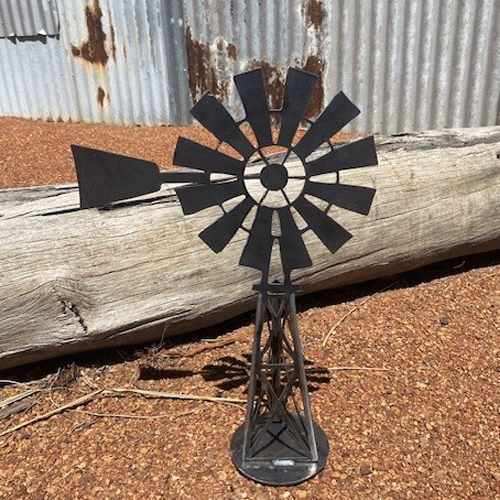 Southern Cross Windmill 3d Metal Garden Art - Raw Finish - Left Facing in Garden