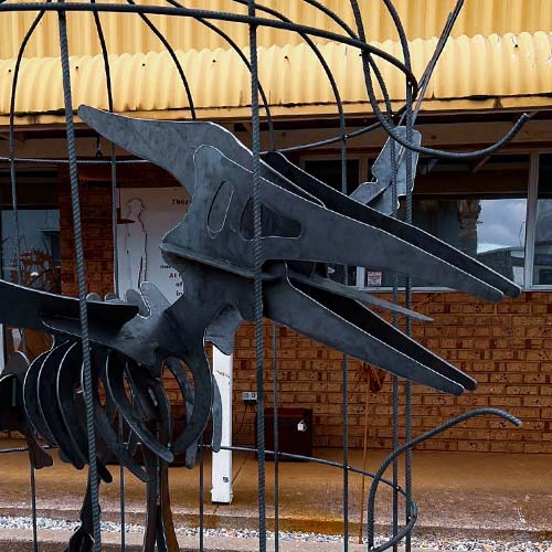 Pterodactyl In A Cage Large Dinosaur Sculpture