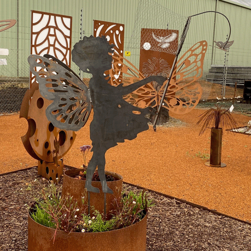 3d Metal Fairy with a net catching a butterfly